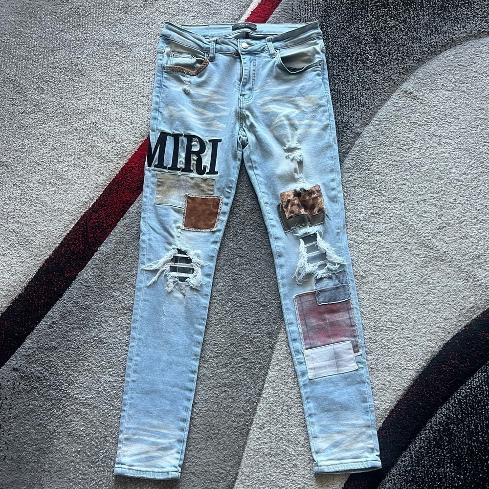 Amiri Grunge Light Wash Patchwork Distressed Jeans
